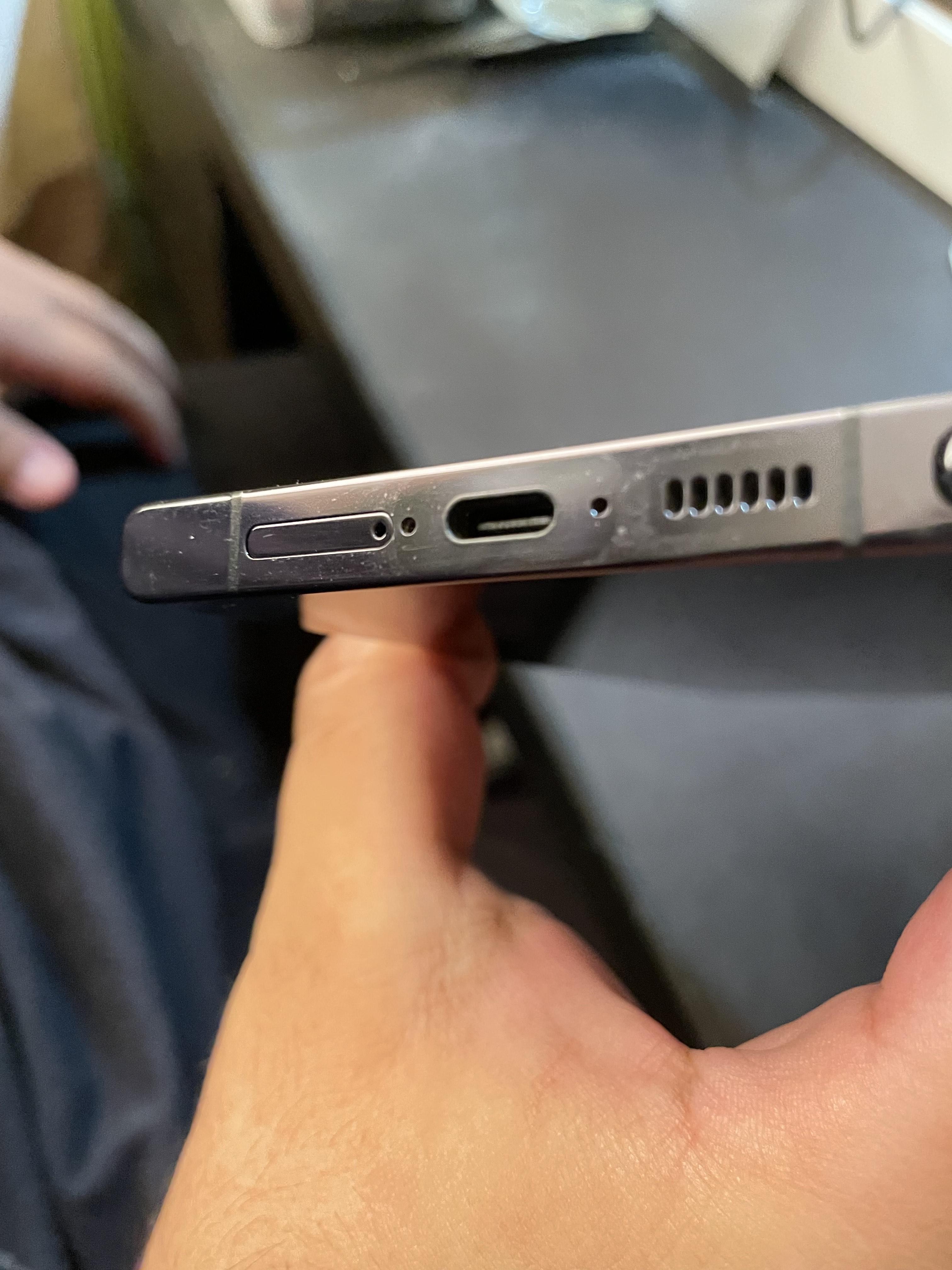 Close-up of Spigen case material showing scratch resistance
