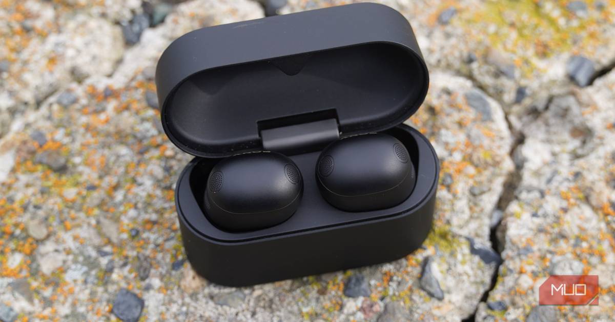 Sony WF-1000XM6 earbuds and charging case on a dark background