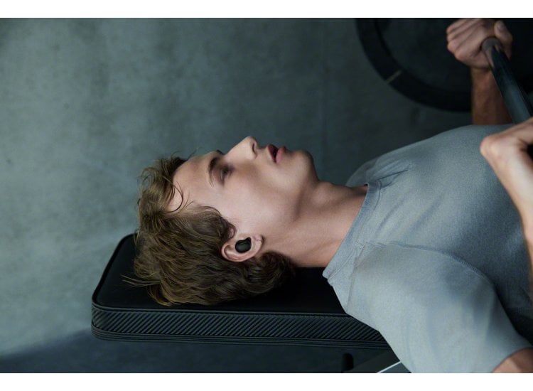 Athlete running with Sony WF-1000XM6 earbuds at gym