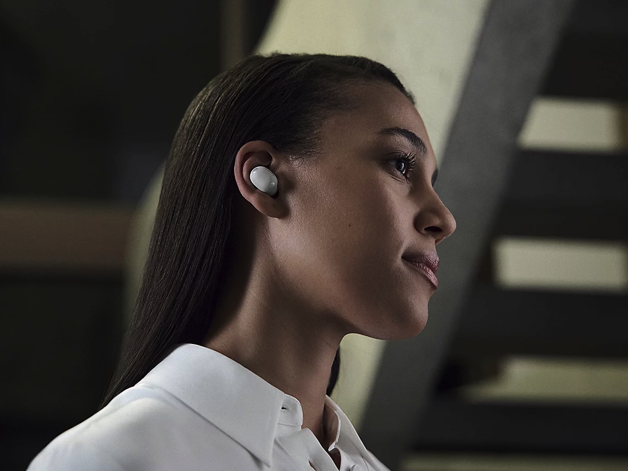 Person commuting with Sony WF-1000XM6 earbuds on subway