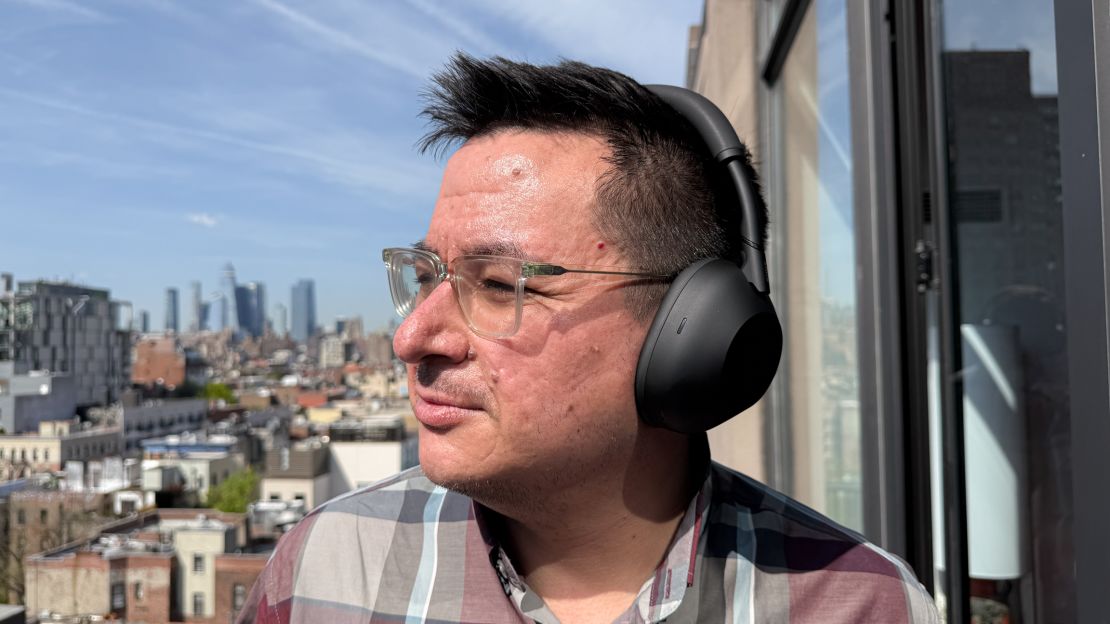 Person wearing Sony WH-1000XM6 headphones comfortably