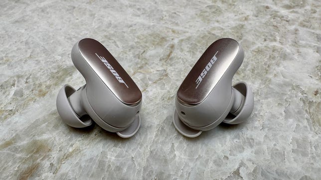 Bose QuietComfort Earbuds II or Ultra on a table